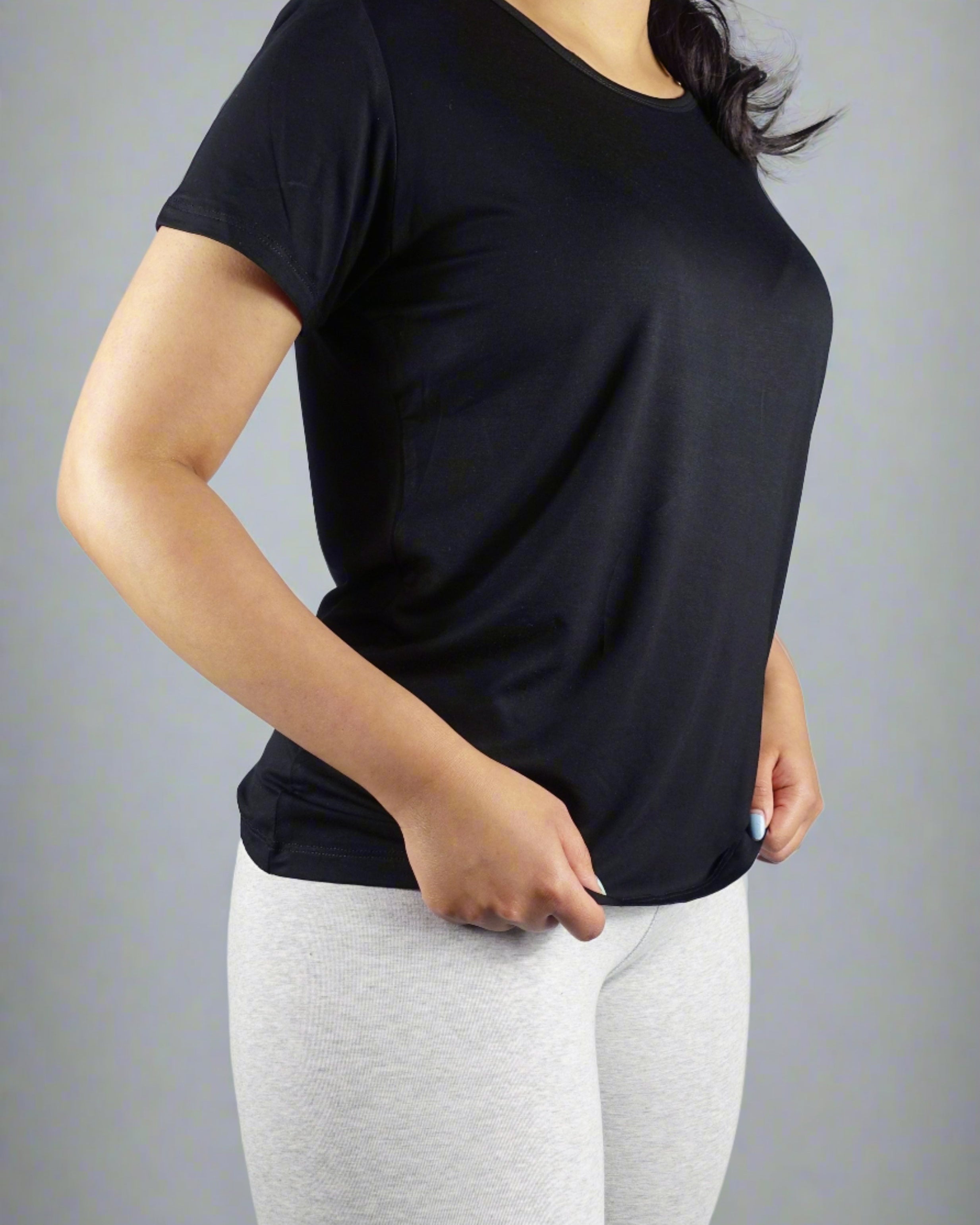 Woman wearing a black crew neck t shirt