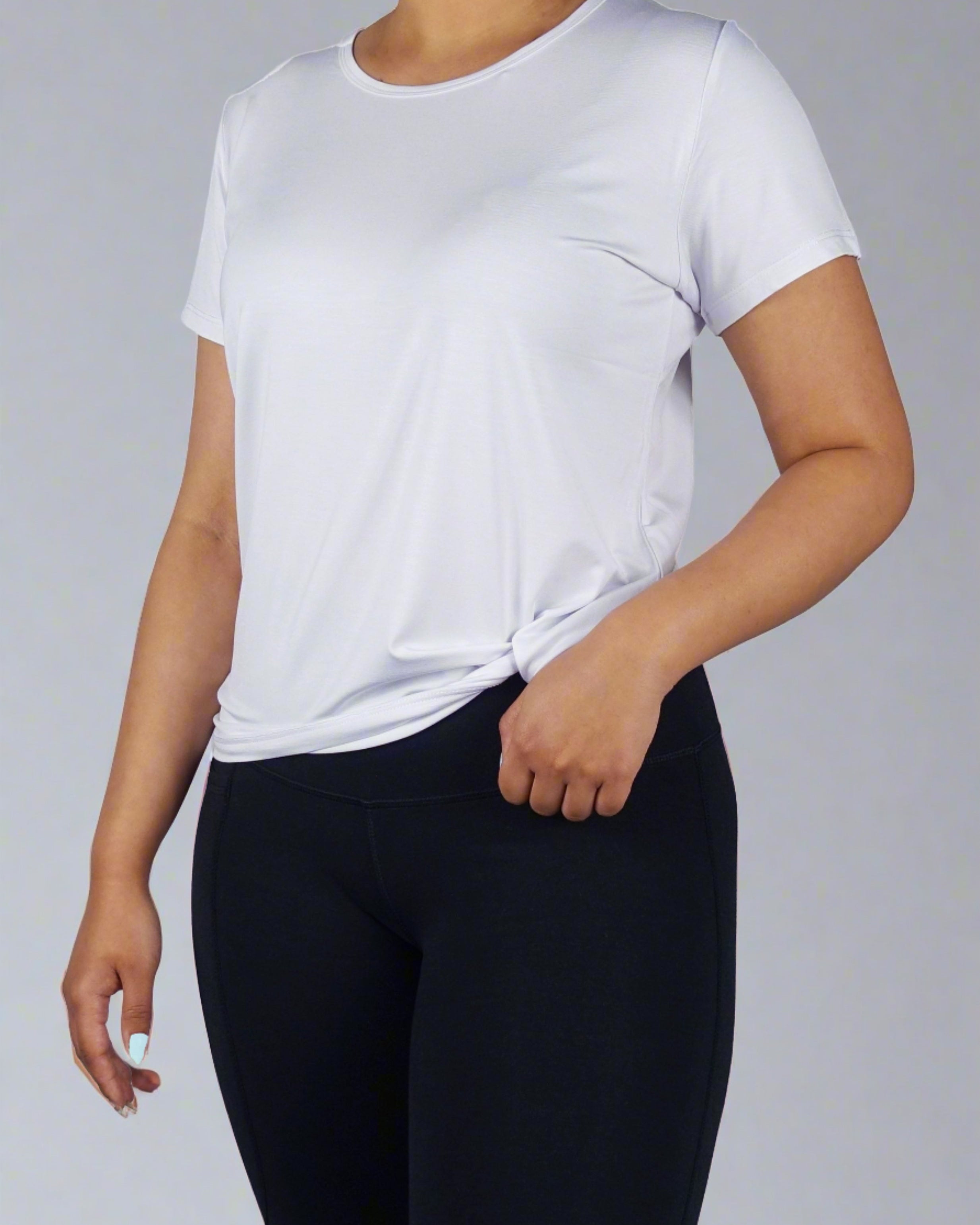 Women wearing a ultra soft white crew neck tee shirt