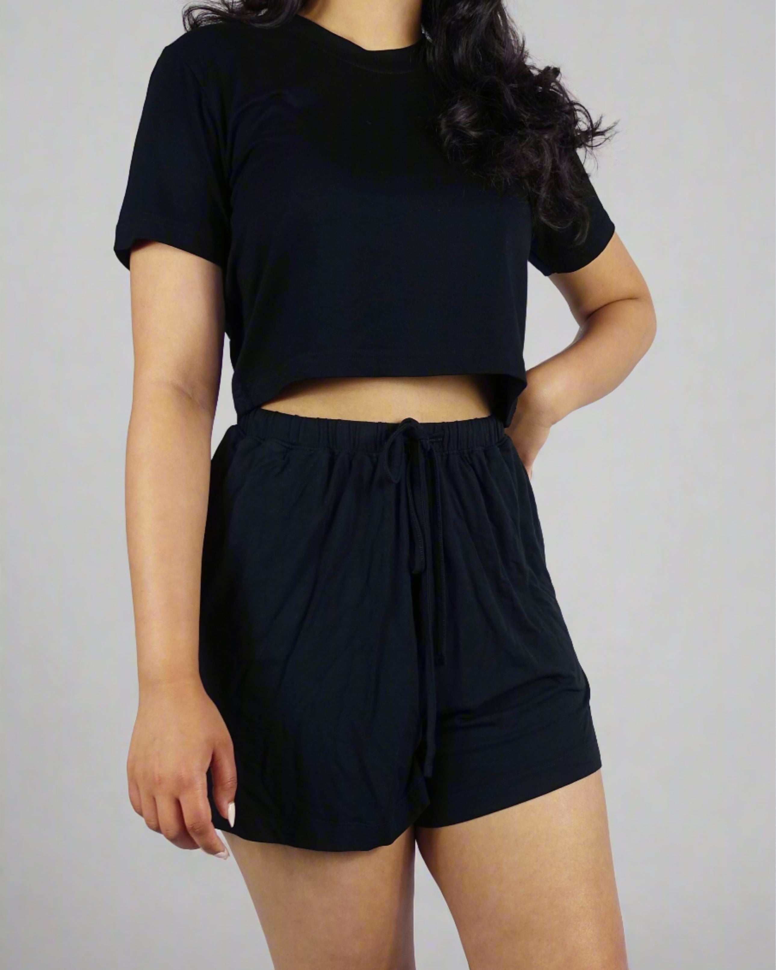 Black crop top with a casual style on a model with a white background