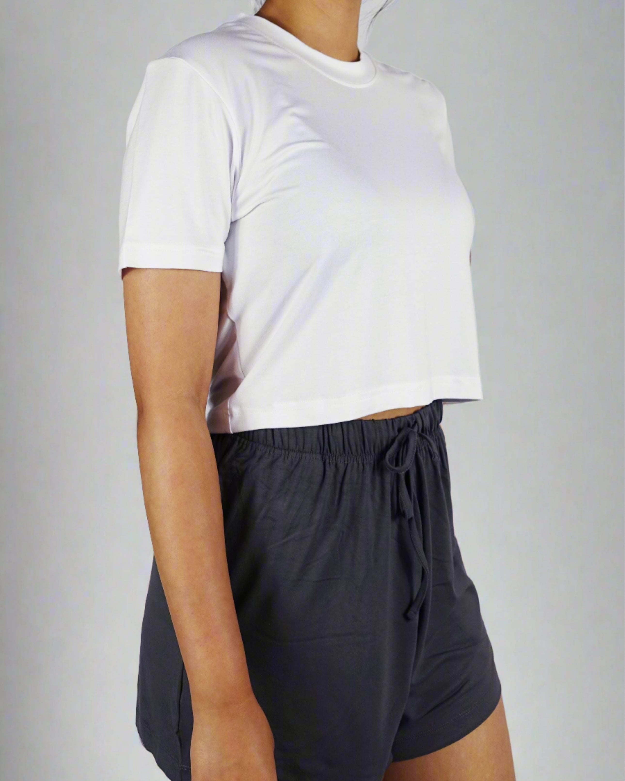 A woman wearing comfortable white crop with round neck and short sleeve top