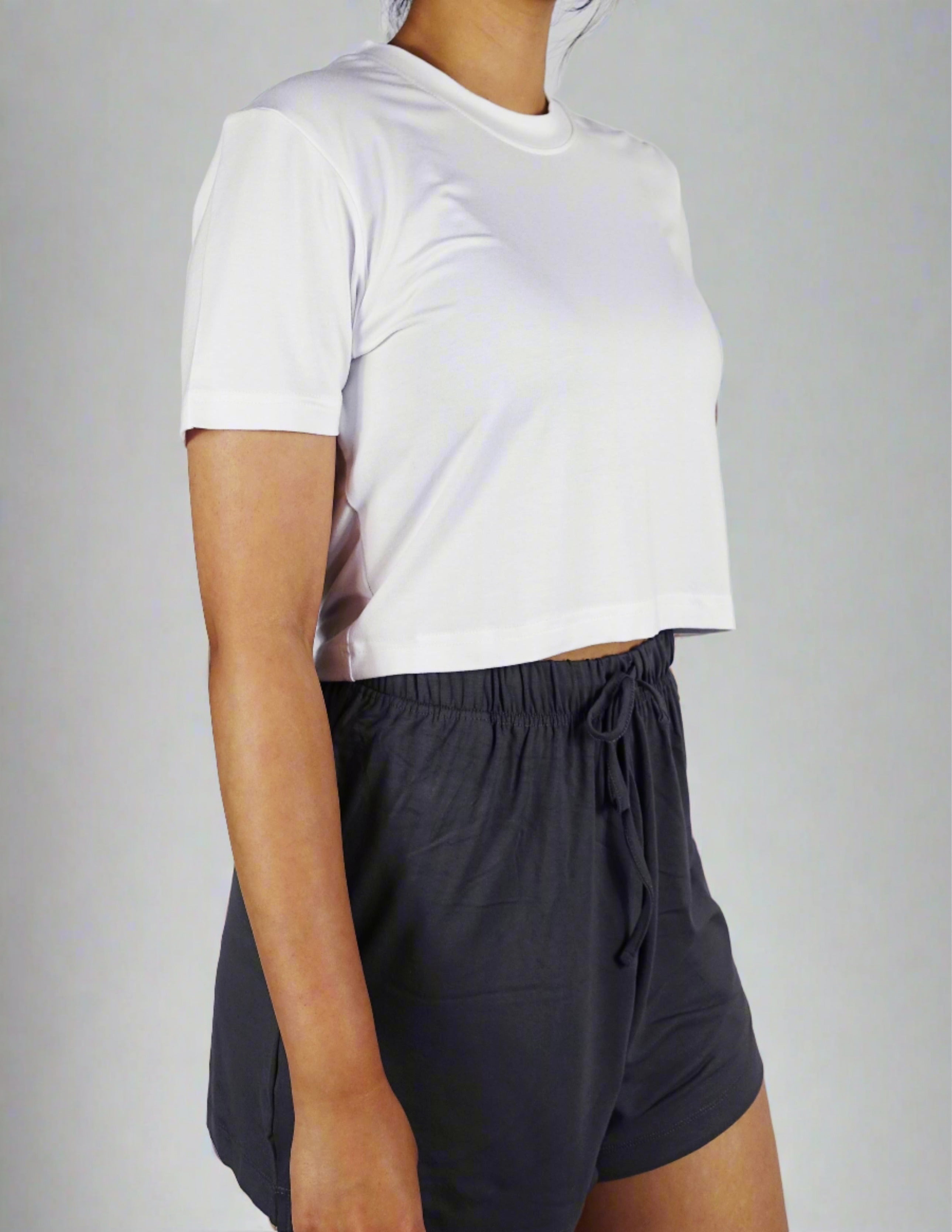 A woman wearing comfortable white crop with round neck and short sleeve top