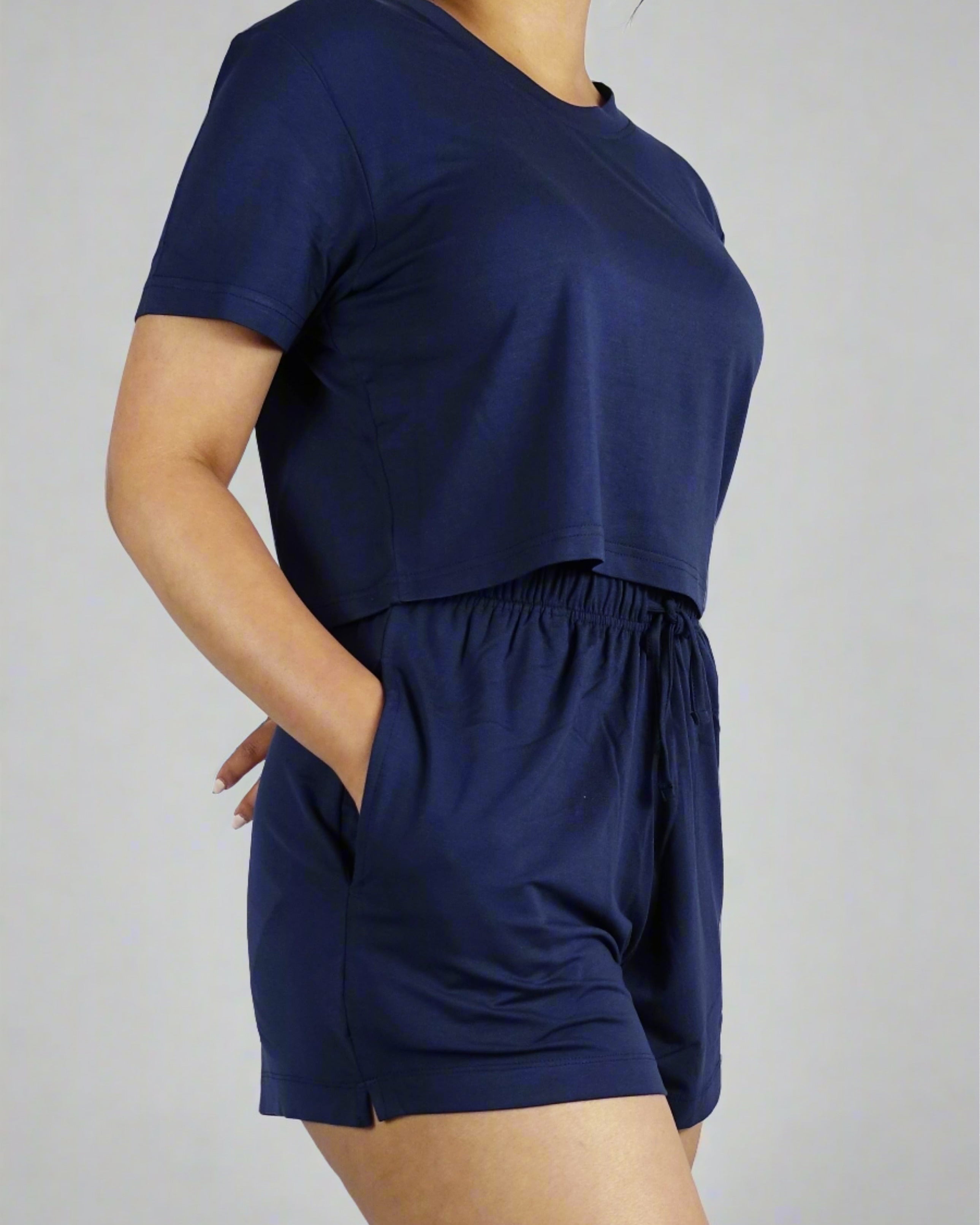 A woman wearing soft and breathable navy crop top