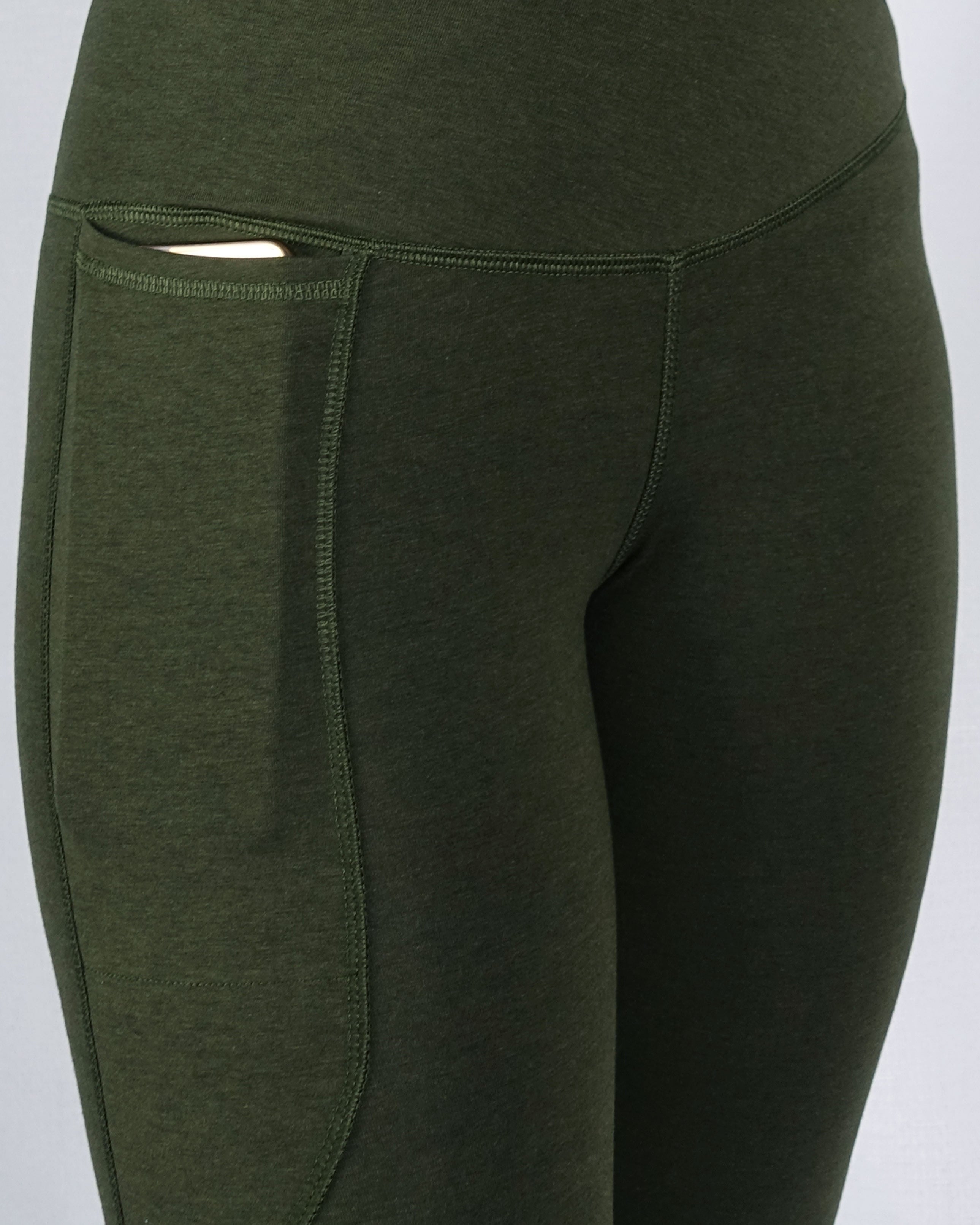 Bamboo high-waist leggings in khaki are shown in a close phone pocket view.