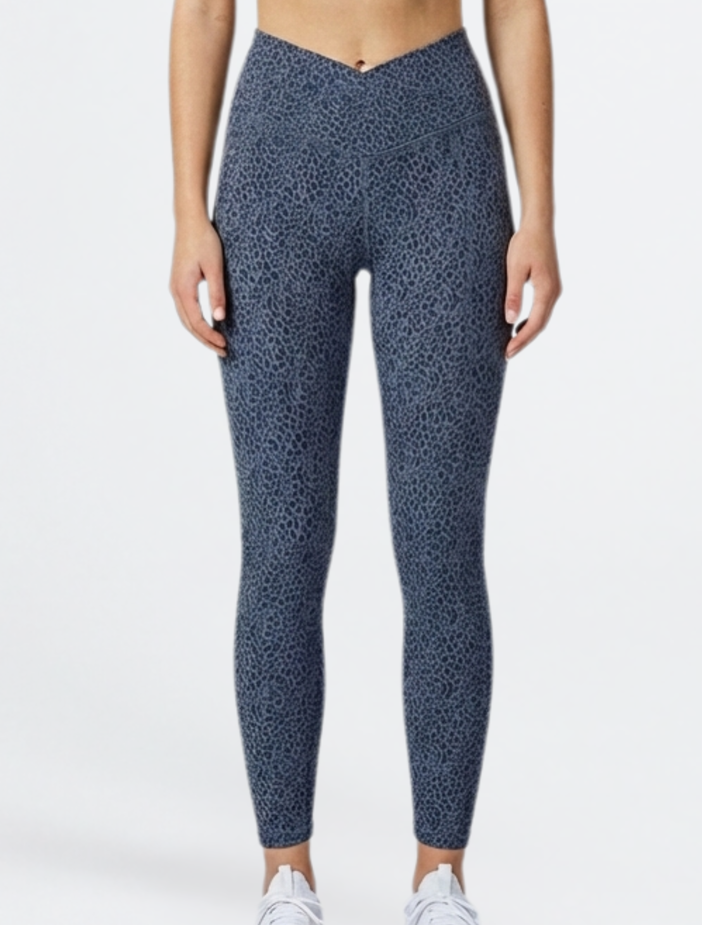 Person wearing blue patterned leggings_Bamboo Super Soft V Cross Waist Phone Pocket Legging Yoga Gym Breathable Hypoallergenic Tights_ on a white background