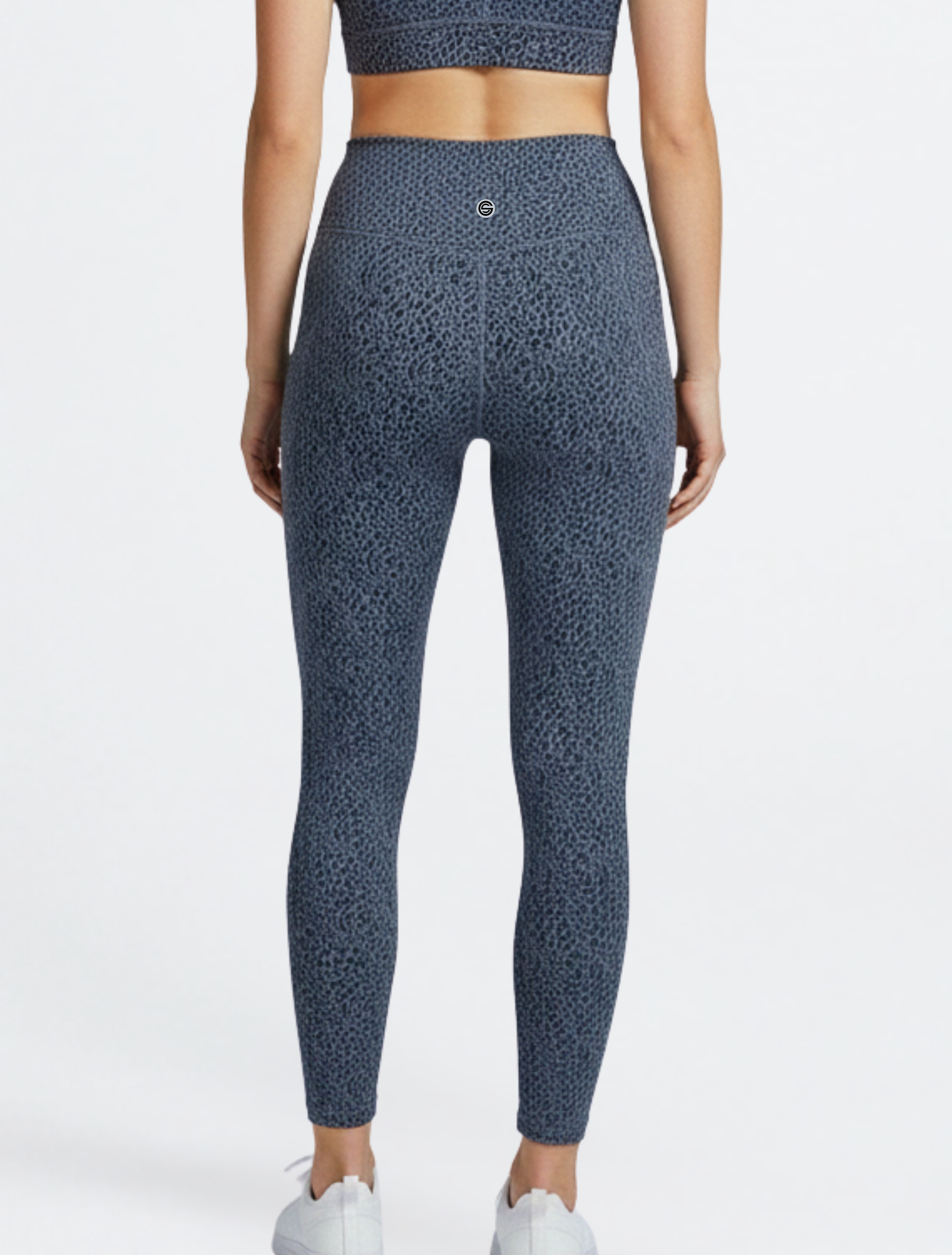 Back side of the person wearing blue patterned leggings leopard print Bamboo Swift Cross Waist Legging Super Soft Breathable Hypoallergenic_ Active by GS on a white background