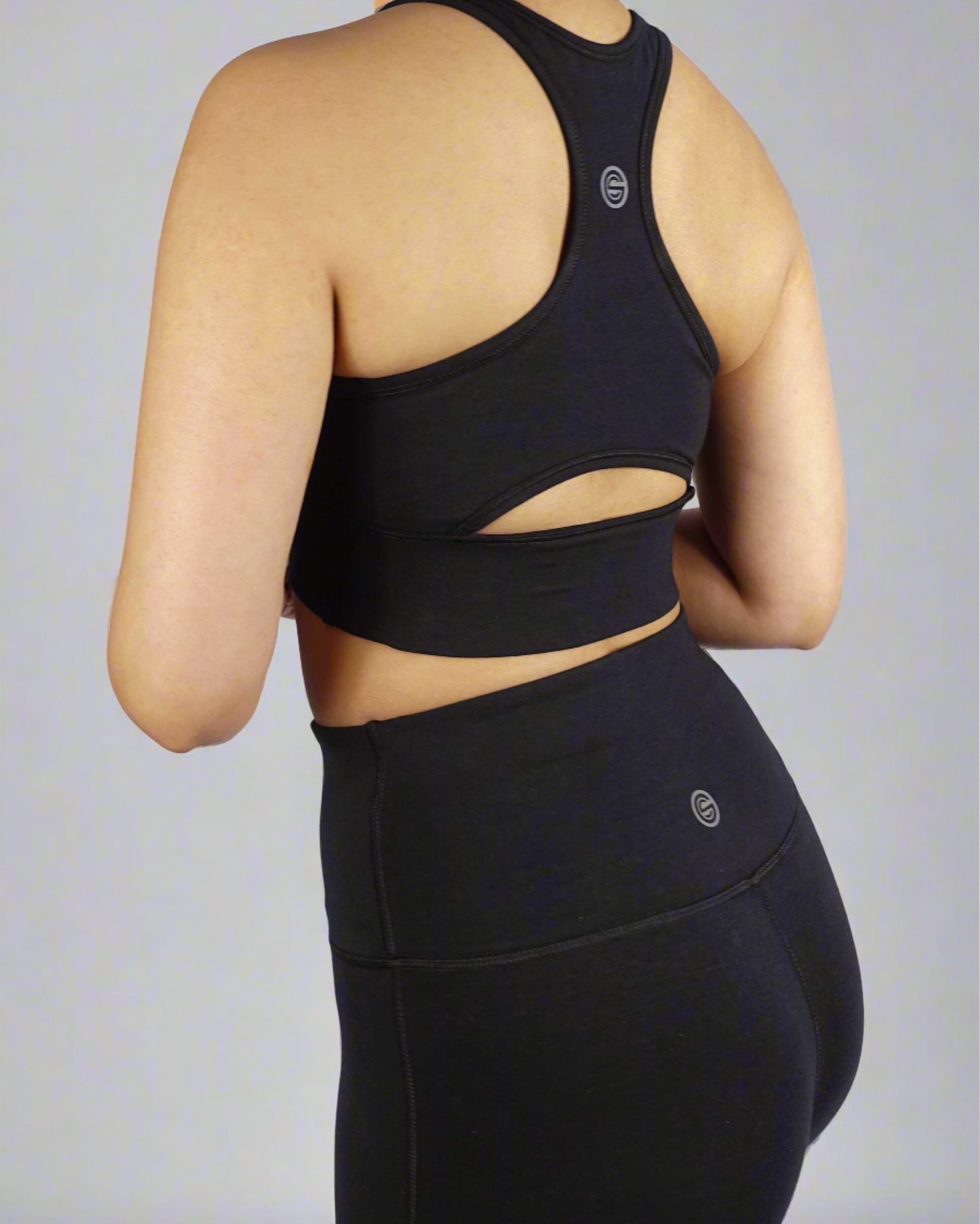 Side view of black sports bra with keyhole cut and side panel stitch for comfort