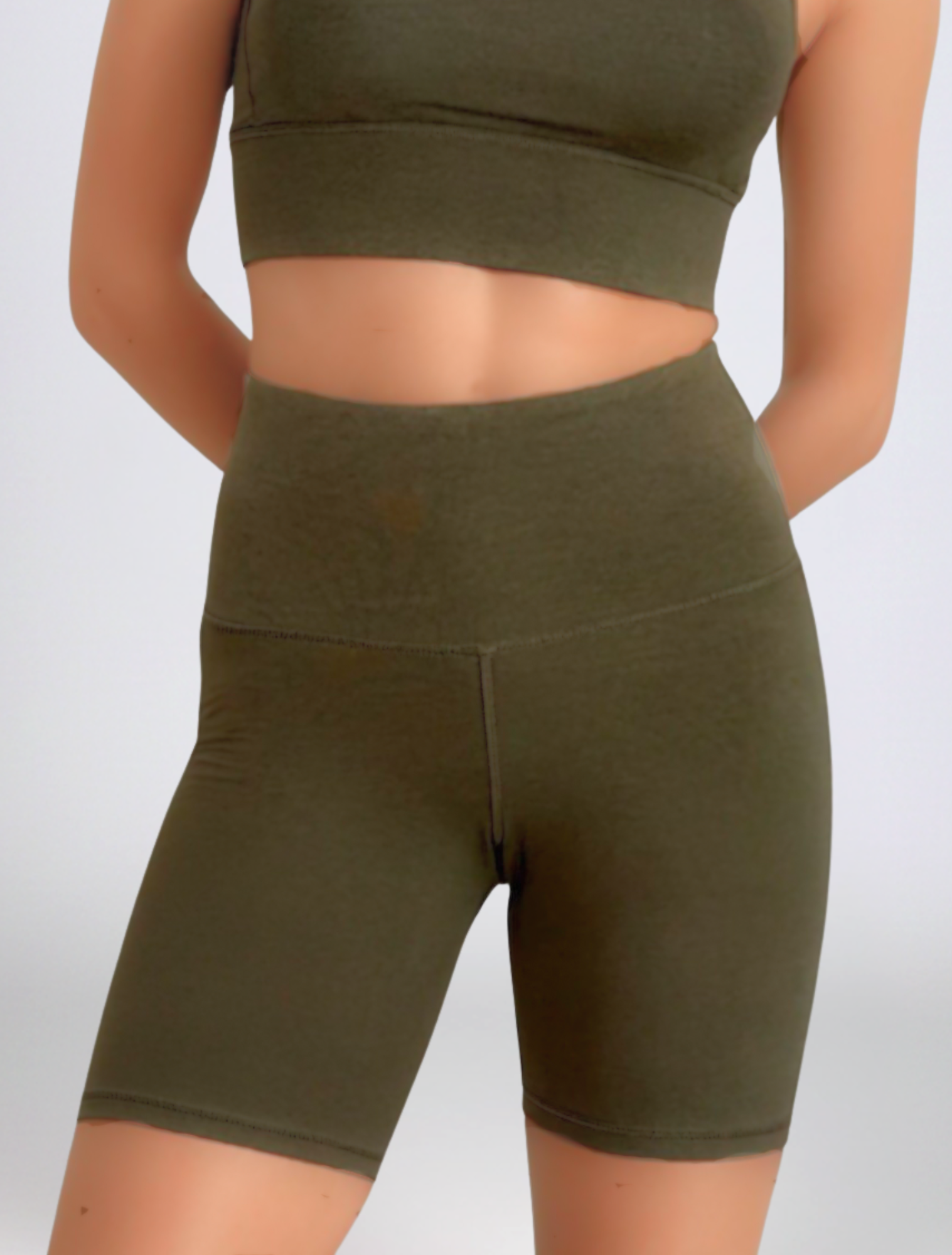 Person wearing olive green Khaki Motion High Waist Phone Pocket Shorts Bamboo moisture wicking Active by GS athletic shorts and on a white background