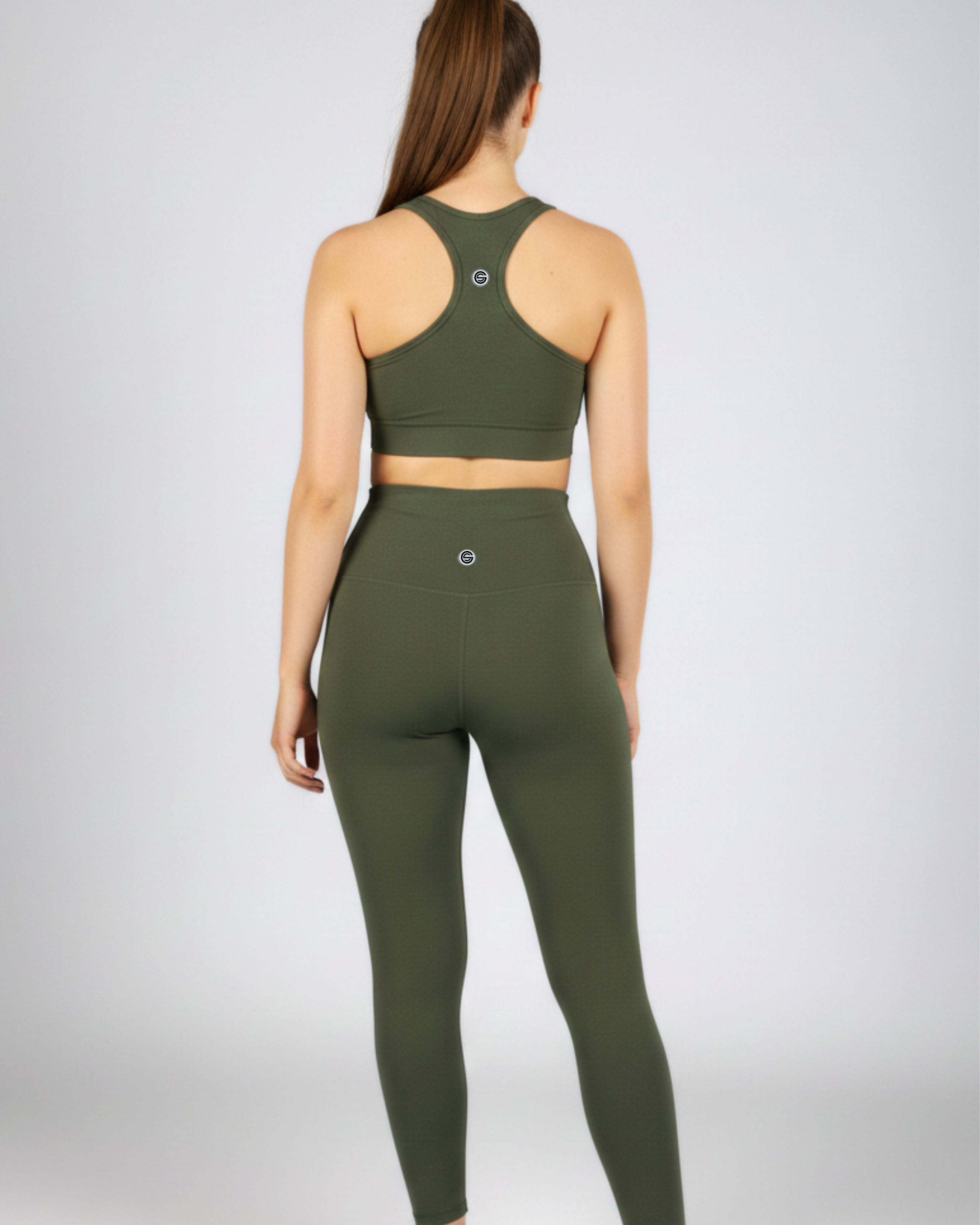 Olive green cross-waist yoga leggings featuring a soft bamboo blend, designed for Pilates, stretching and studio workouts.
