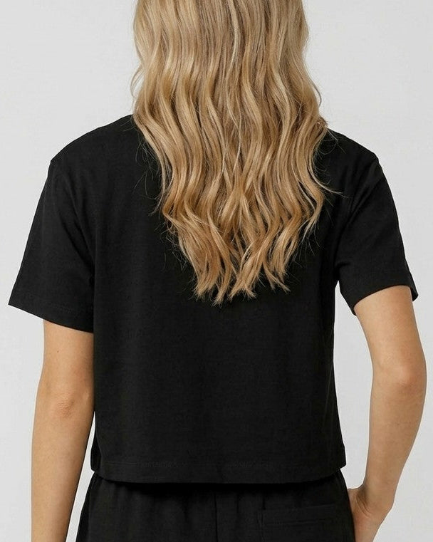 Back view model wearing an oversized boxy crop t-shirt in soft bamboo fabric
