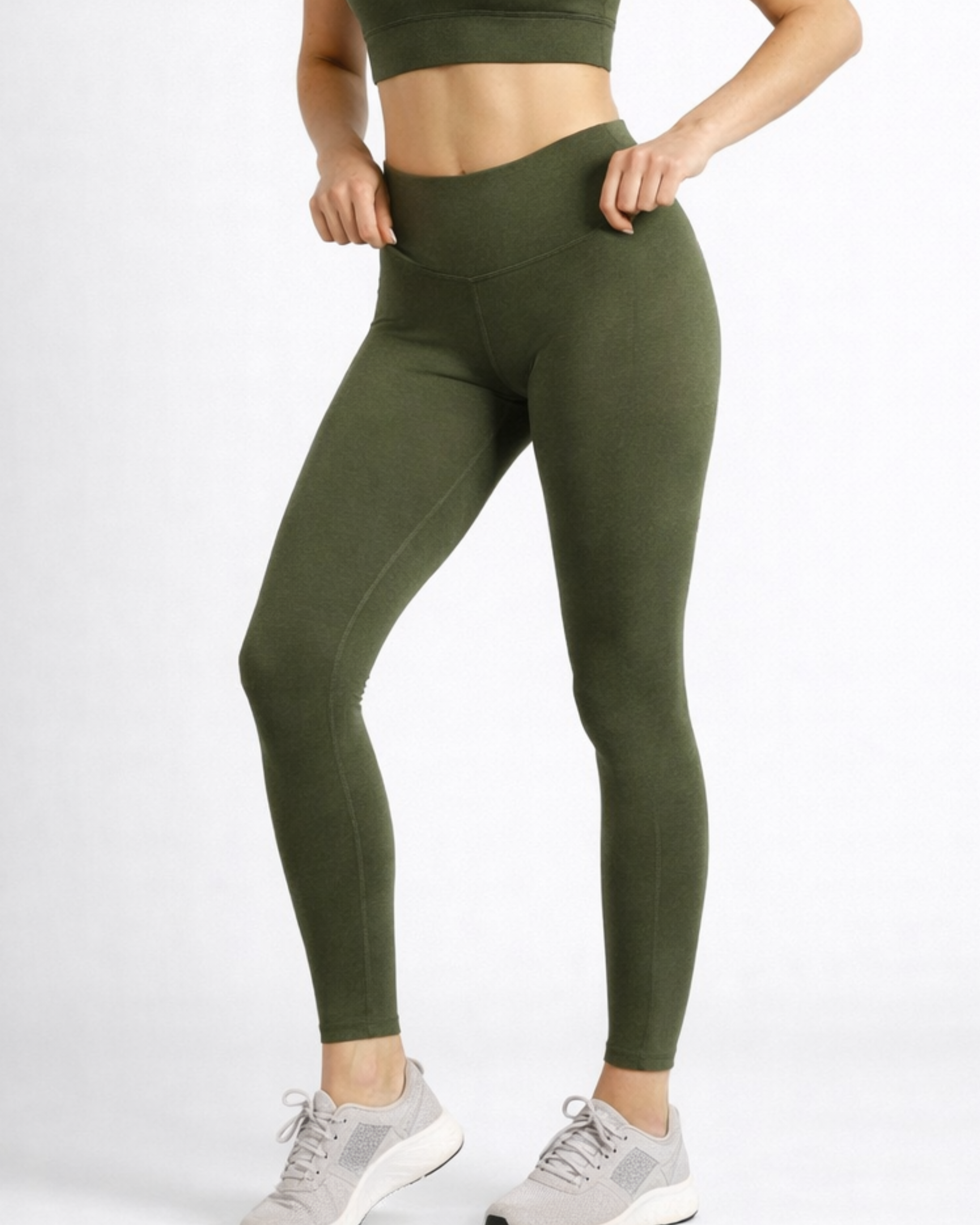 Person wearing green leggings and a cropped top womens bamboo breathable high-waist-phone pocket compression-leggings-khaki-womens_activebygs on a white background