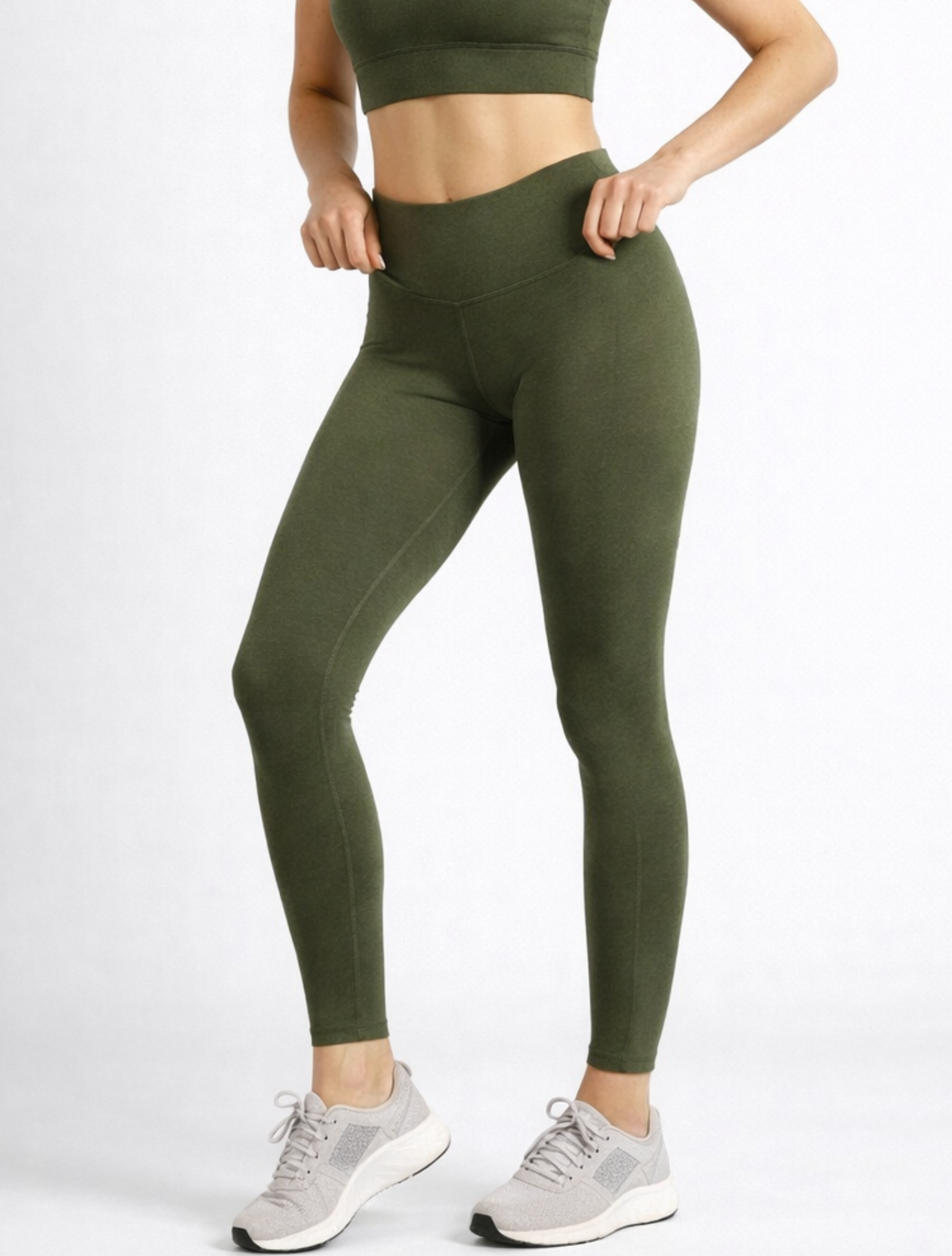 Person wearing green leggings and a cropped top womens bamboo breathable high-waist-phone pocket compression-leggings-khaki-womens_activebygs on a white background