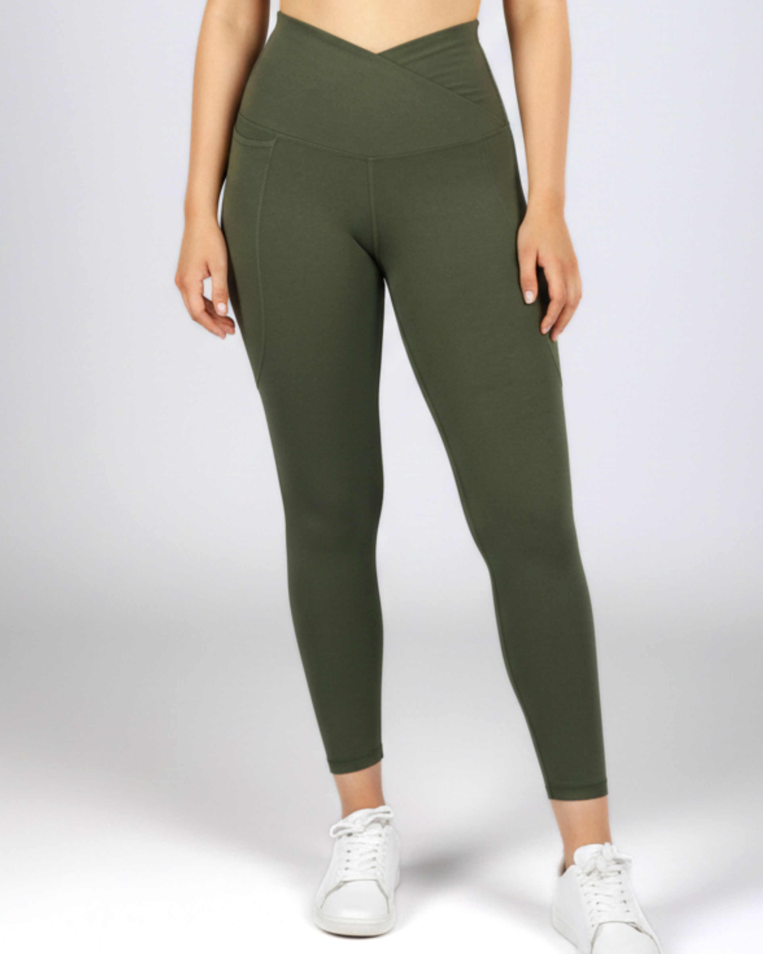 Woman wearing khaki bamboo V-waist leggings with a crossover waistband, designed for yoga, gym workouts and everyday athleisure comfort.
