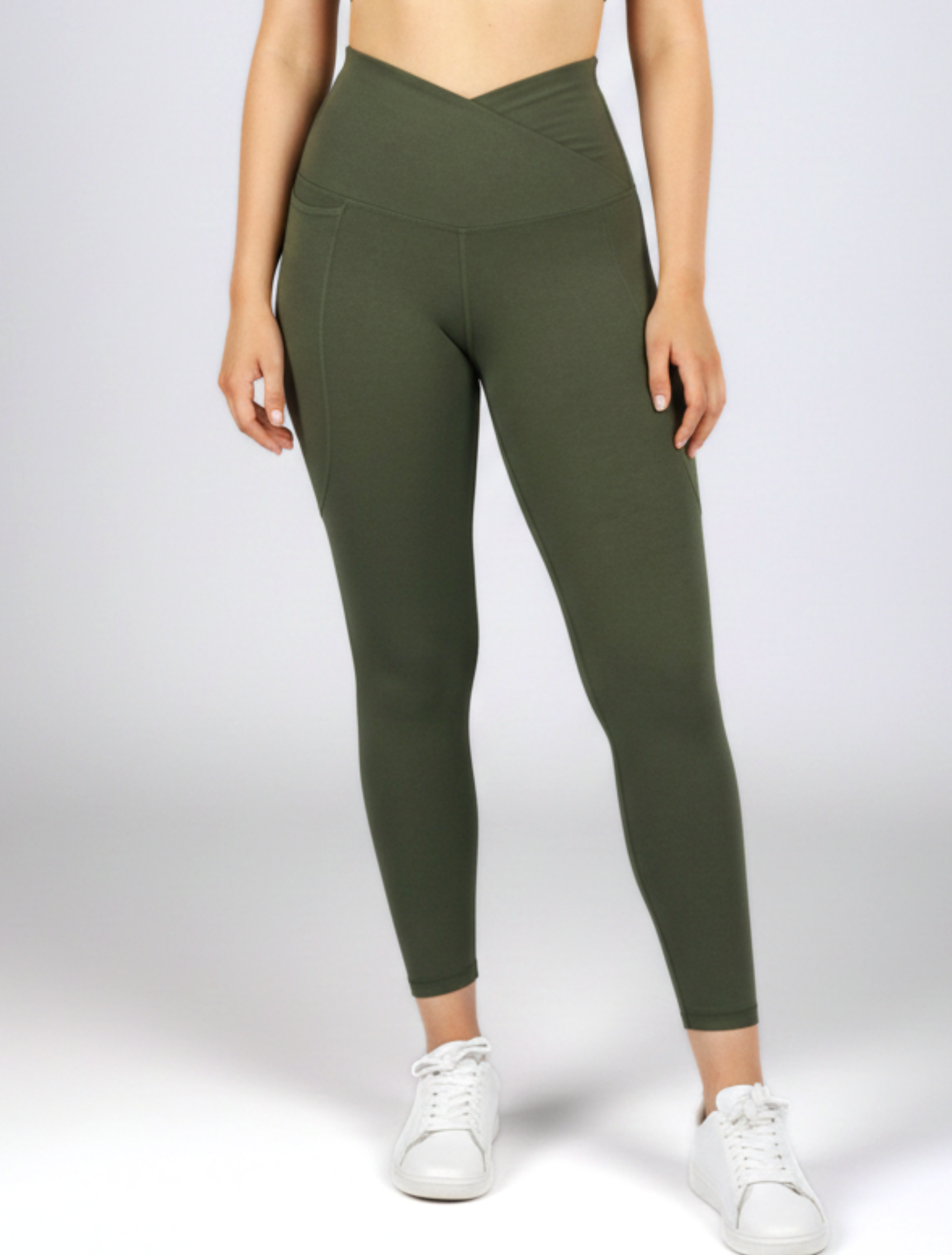Woman wearing khaki bamboo V-waist leggings with a crossover waistband, designed for yoga, gym workouts and everyday athleisure comfort.