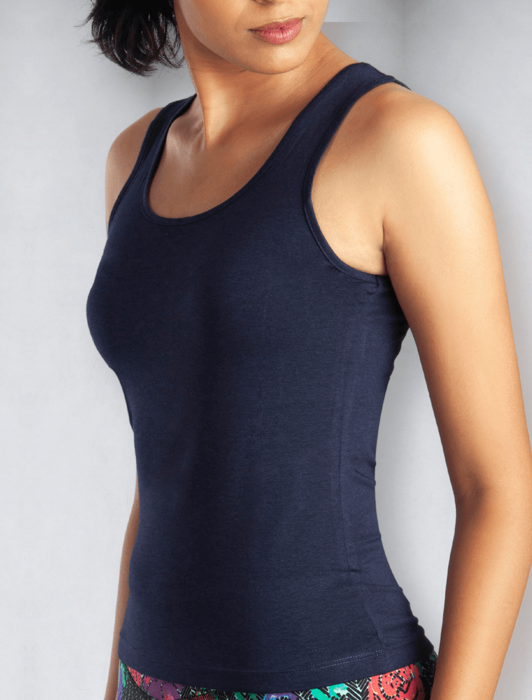 Side view of women's navy blue tank top