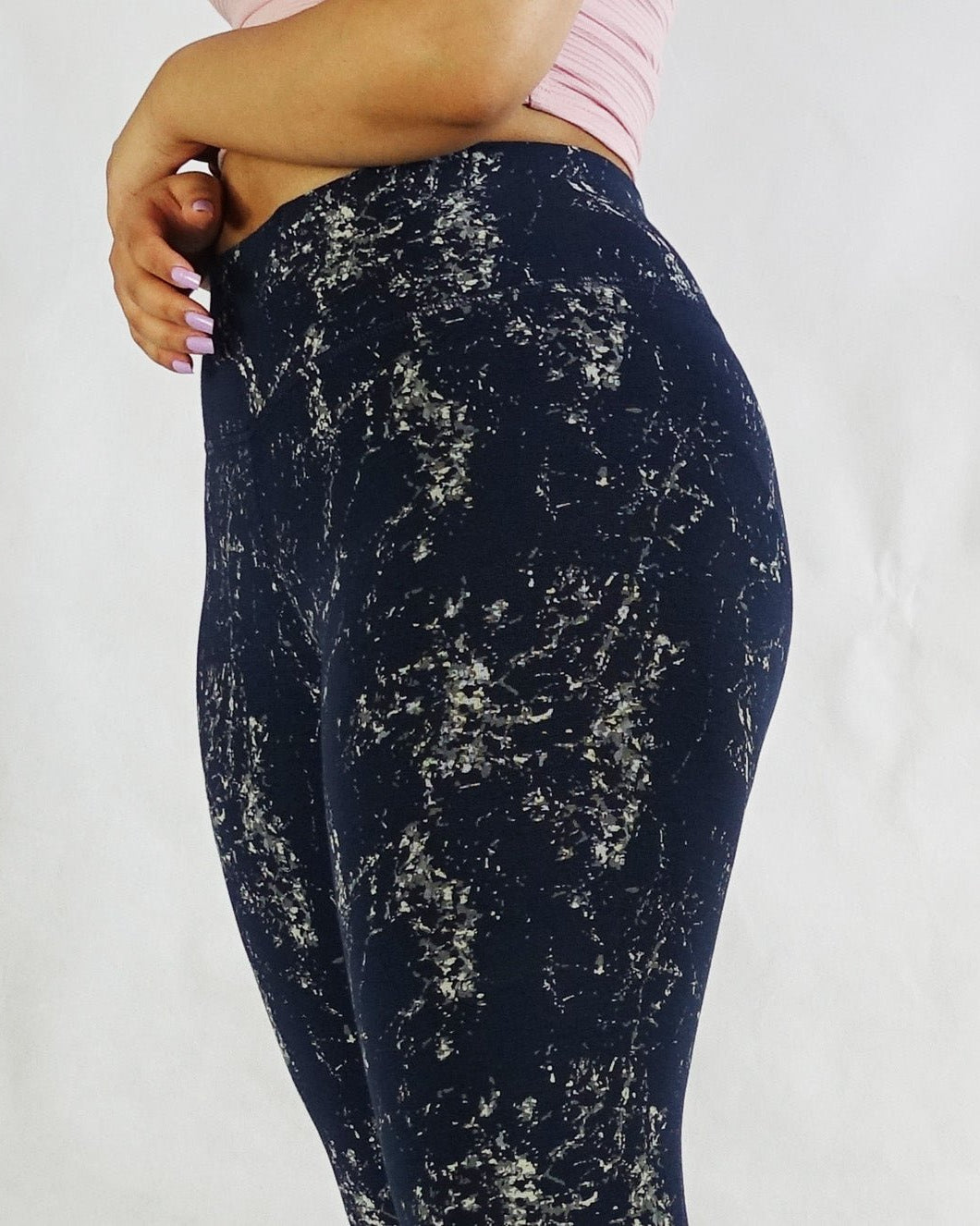 Close up side view of women's blue full length leggings