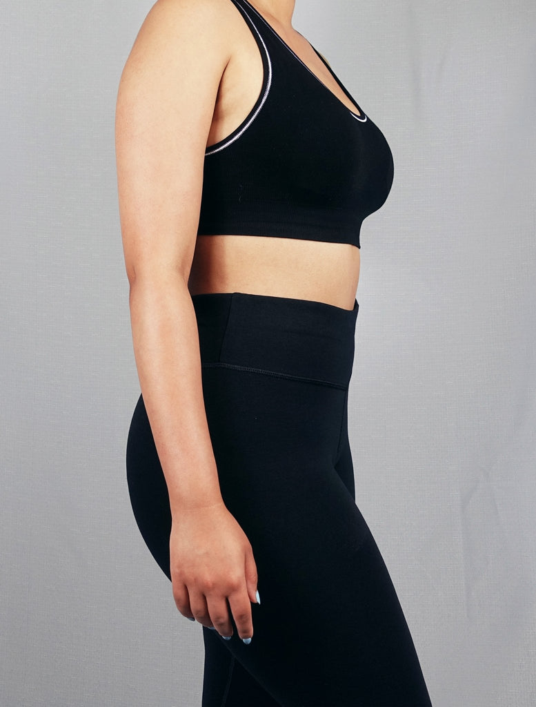 Side view of black padded ribbed sports bra