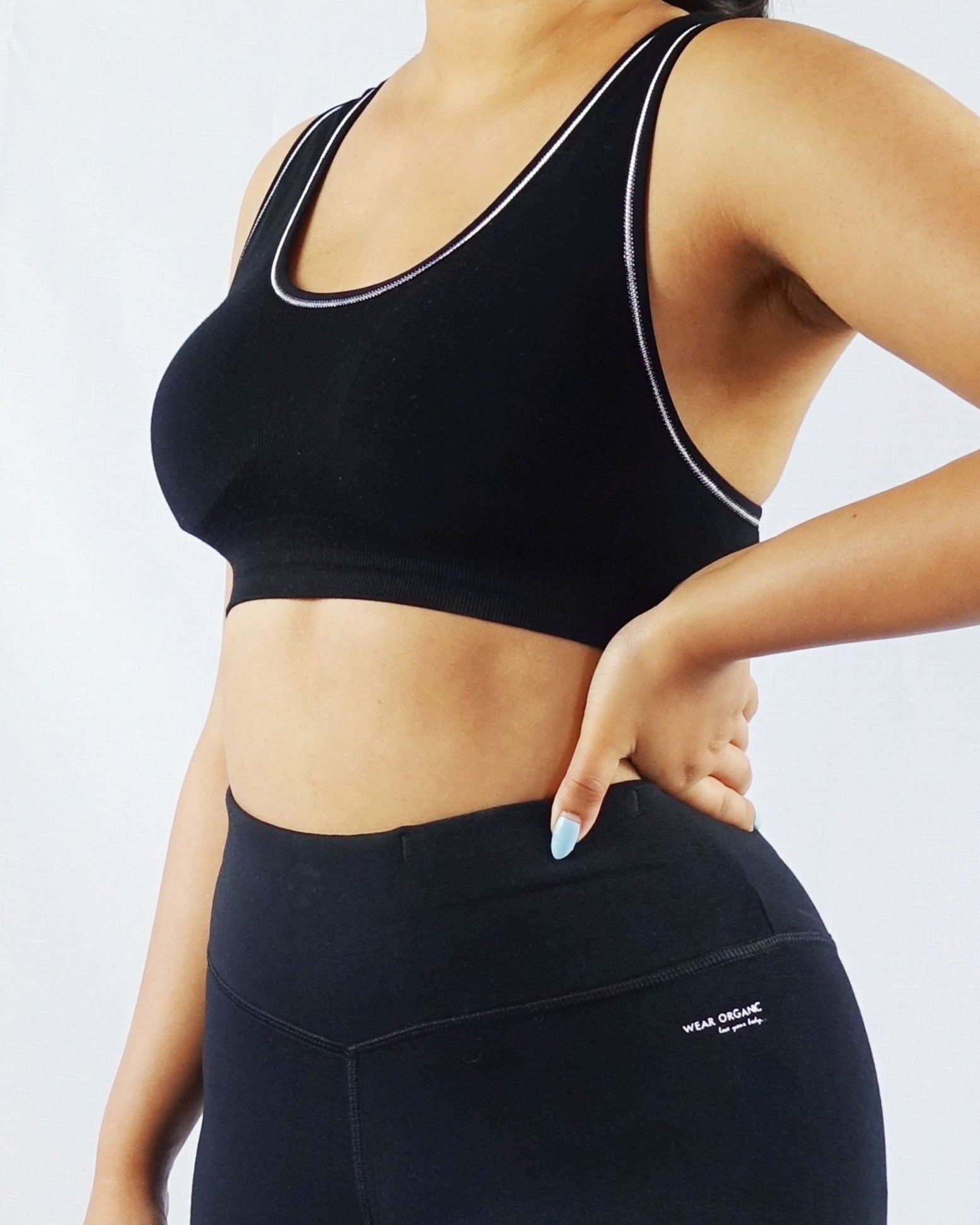 Model wearing black padded soft ribbed sports bra