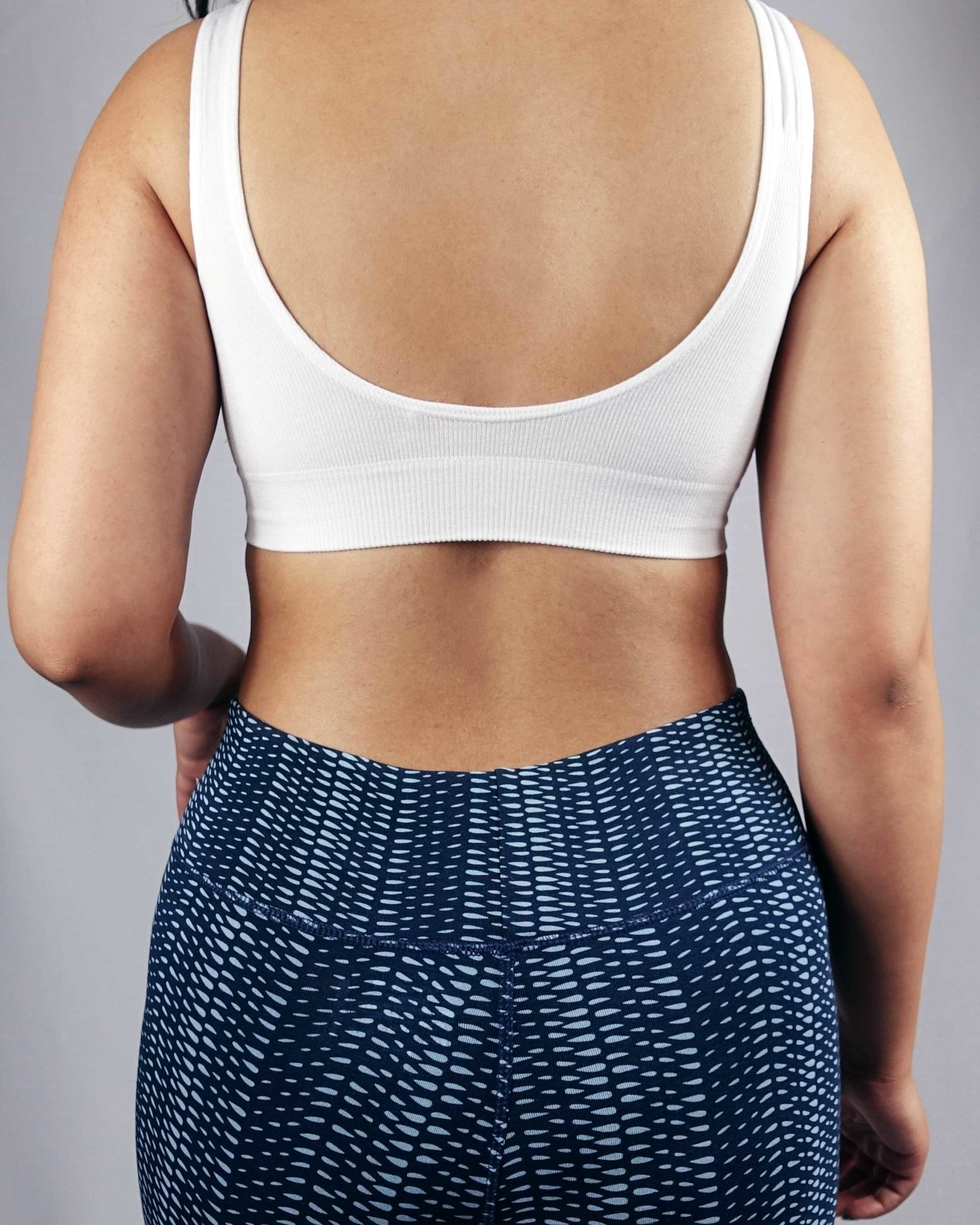 Back view of white soft ribbed seamless wire free bra with removable pads