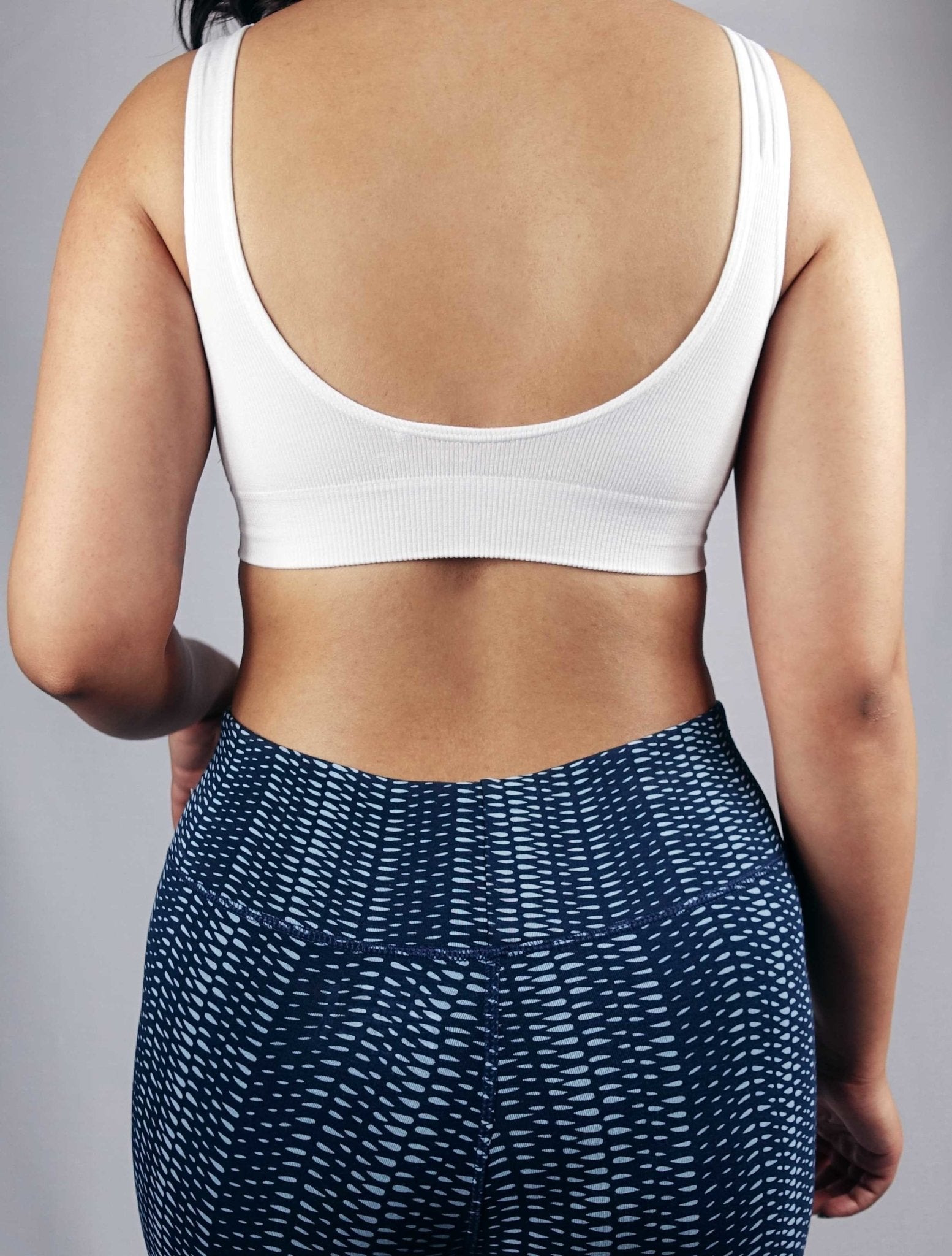 Back view of white soft ribbed seamless wire free bra with removable pads