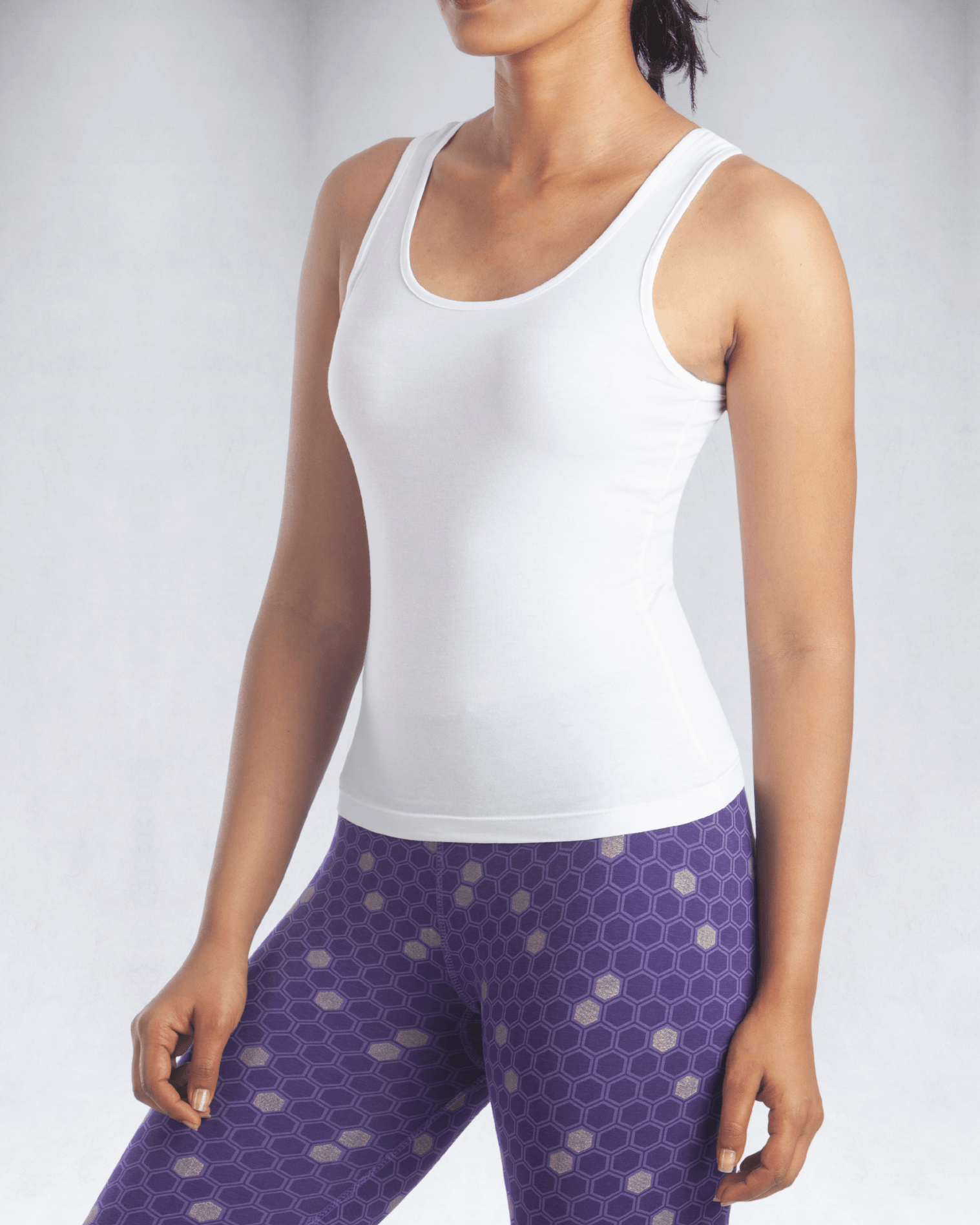 Model wearing women's white tank top