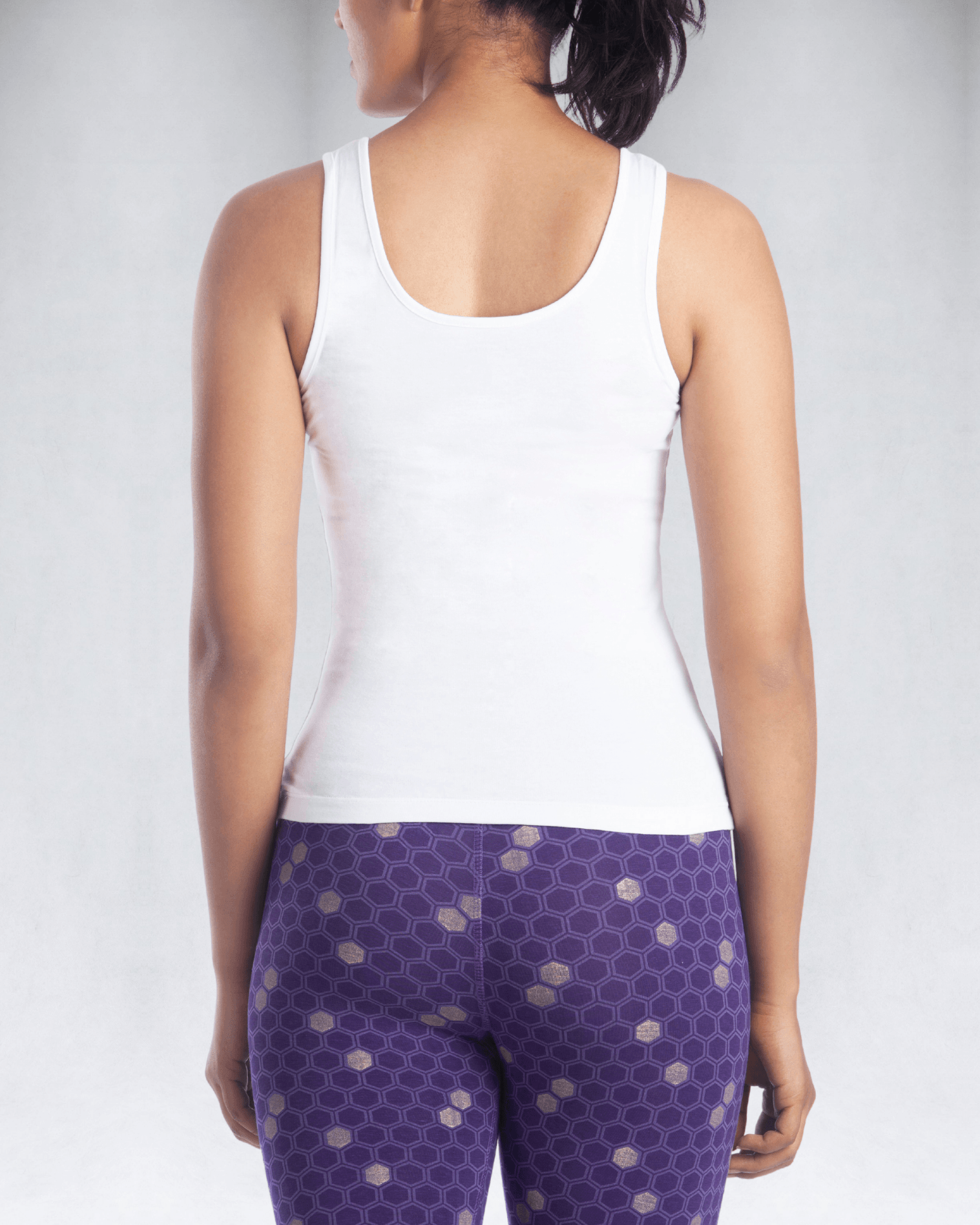 Back view of women's white tank top