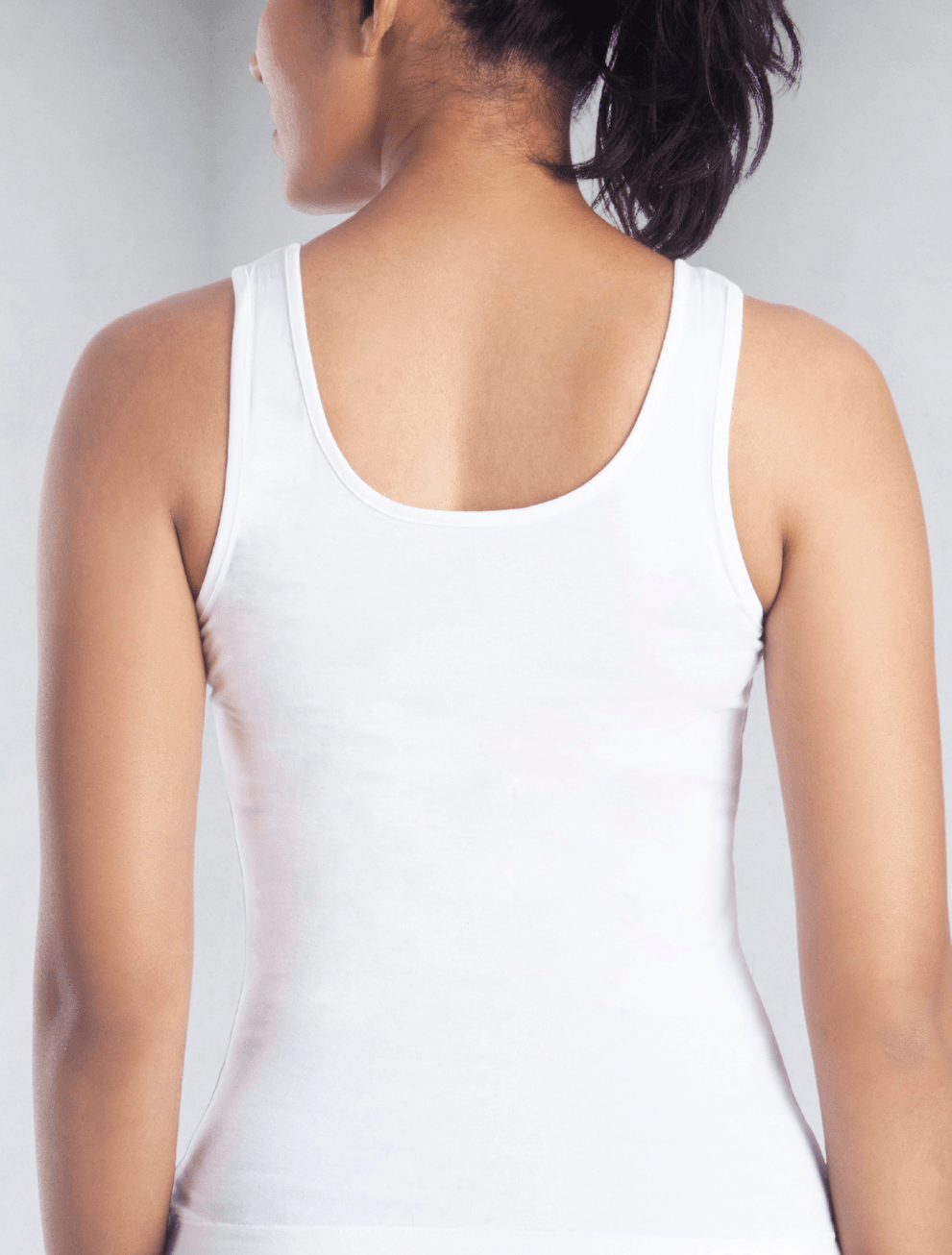 Back view of women's white tank top