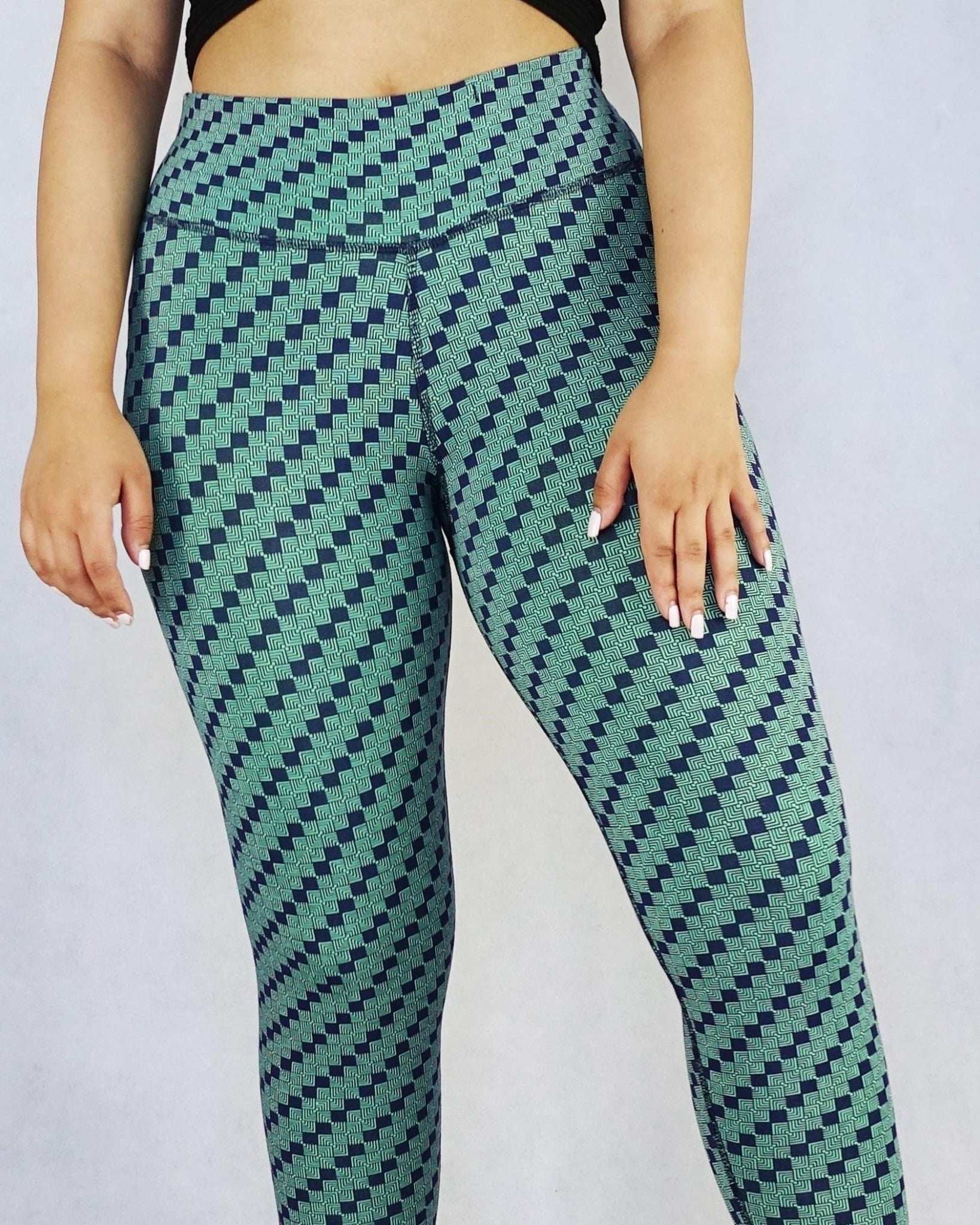 Front view of women wearing green patterned colour full length leggings