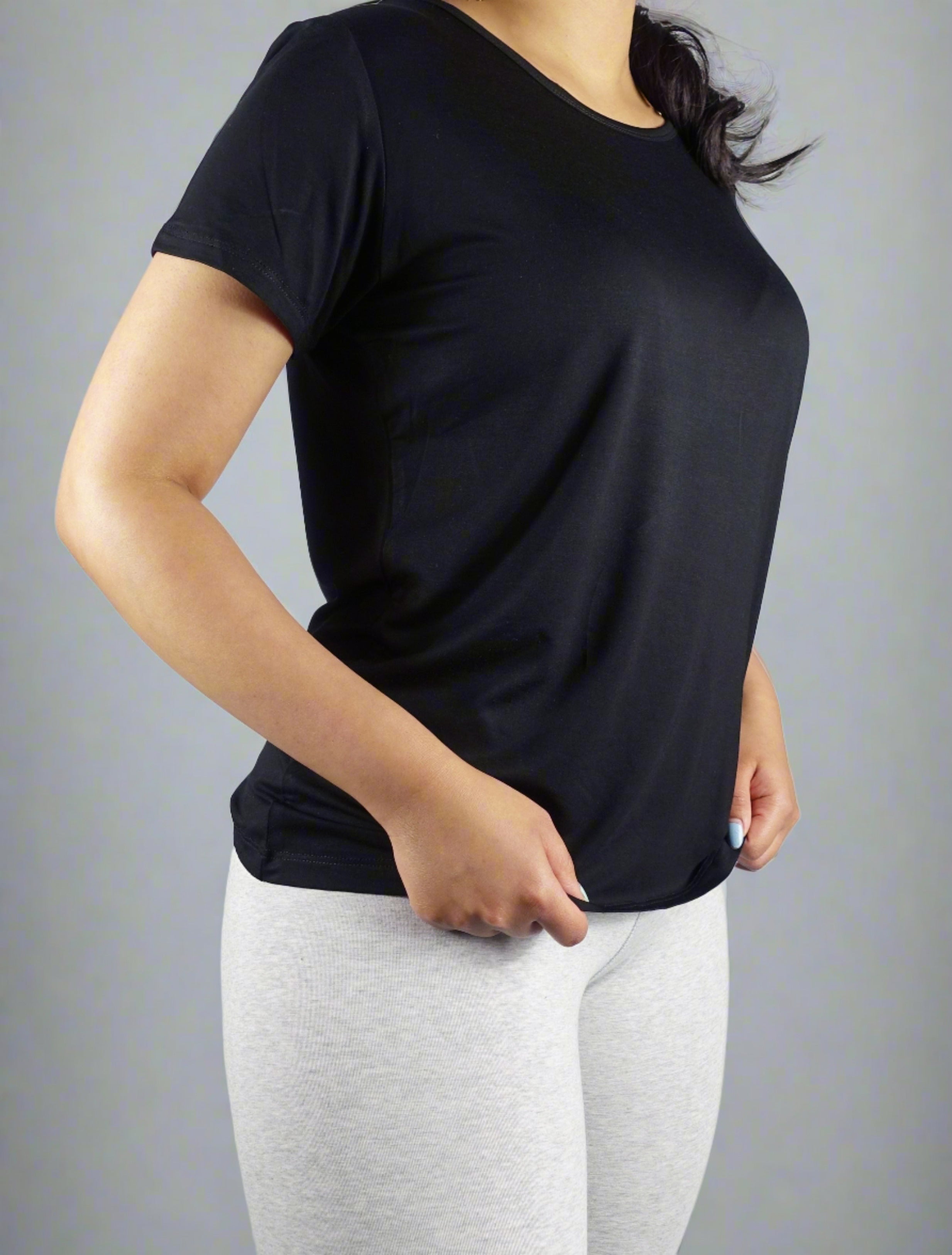 Woman wearing a black crew neck t shirt 