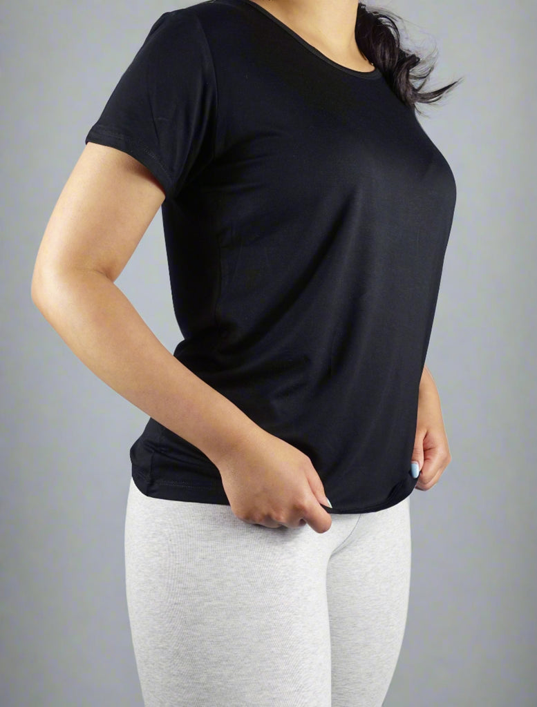 Woman wearing a black crew neck t shirt 