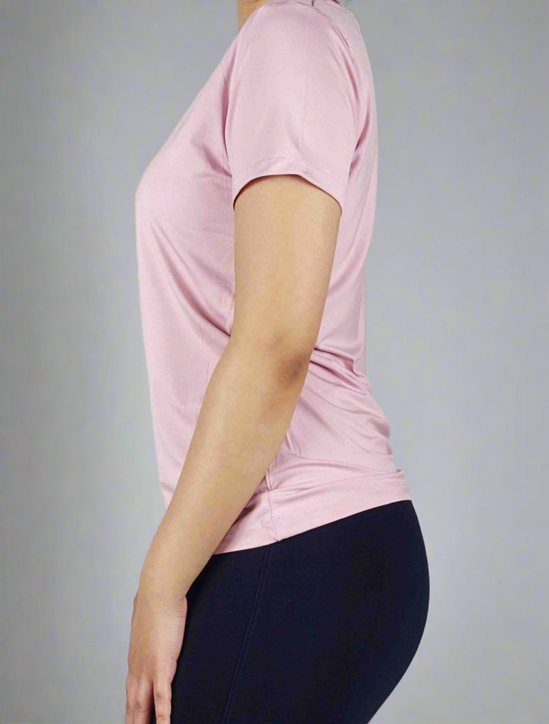 Side view of a women;s pink crew neck t shirt