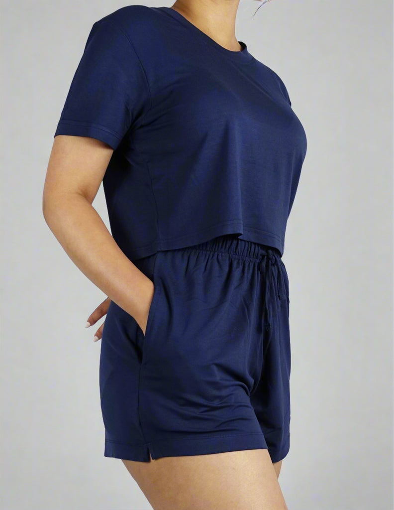 A woman wearing soft and breathable navy crop top 