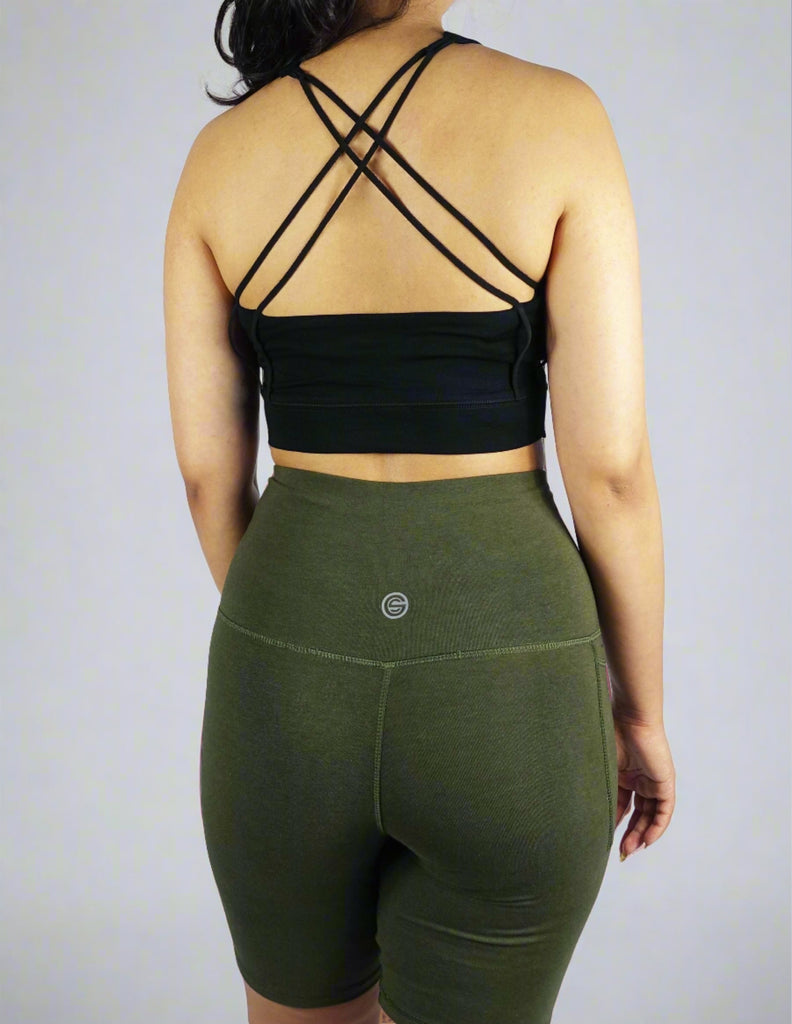 Back view of a black crop top with cross straps in the back