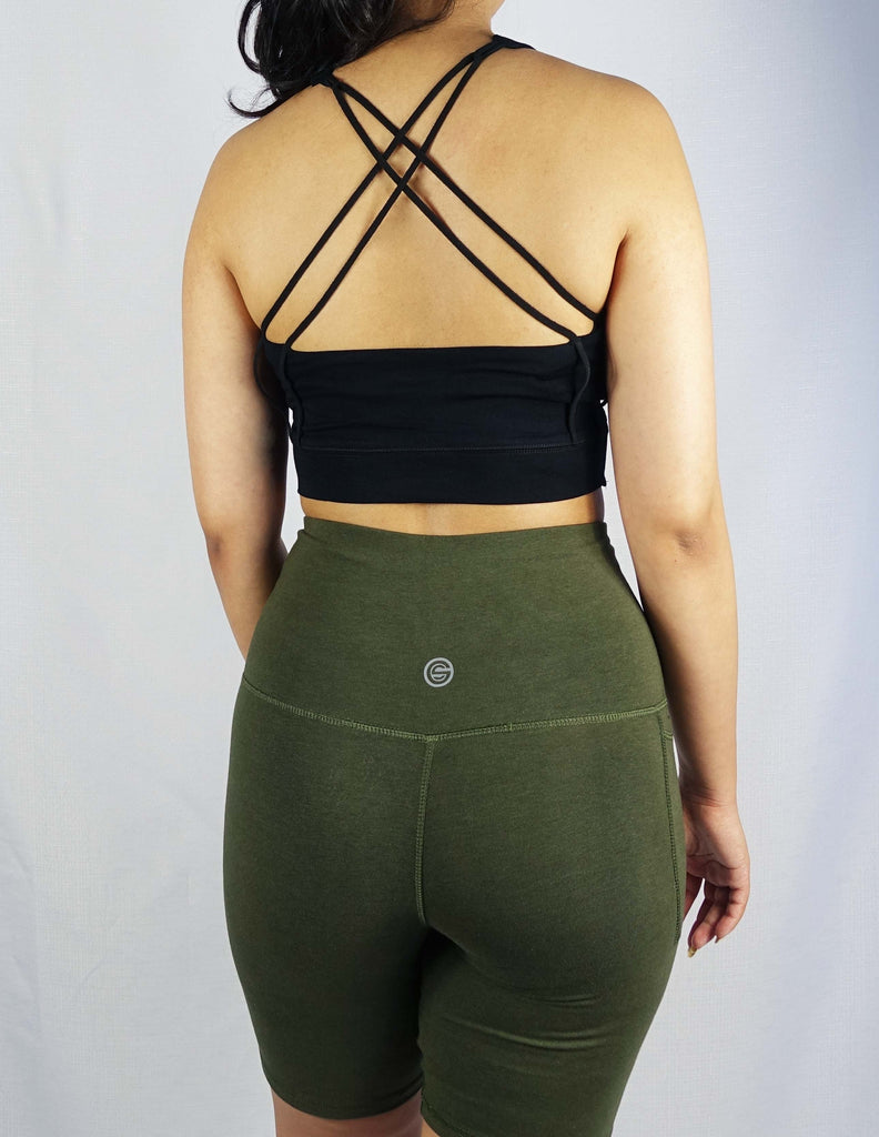 Back view of a black crop top with cross straps in the back