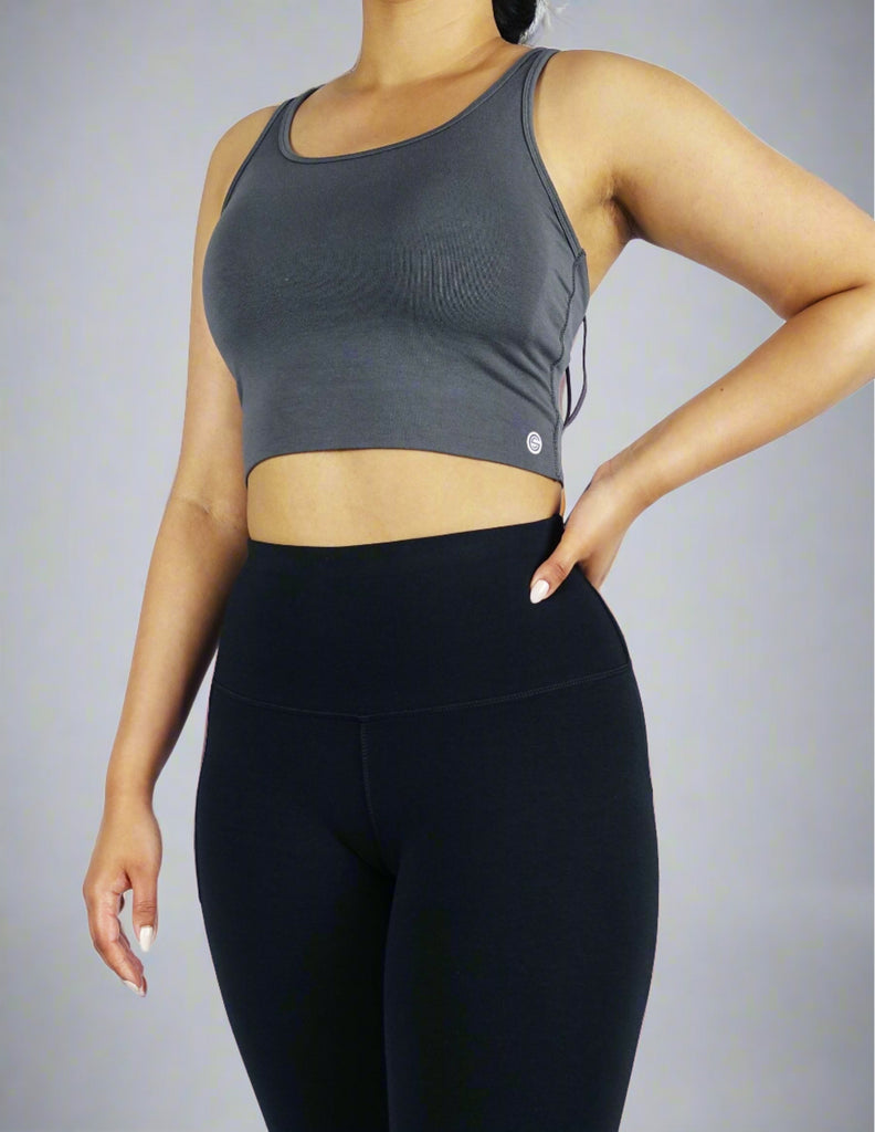 Model wearing a grey crop top 