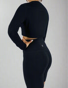 side view of black long sleeve crop tee