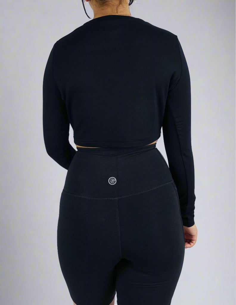 Back view of black long sleeve crop top
