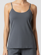Gray tank top worn by a person on a plain background