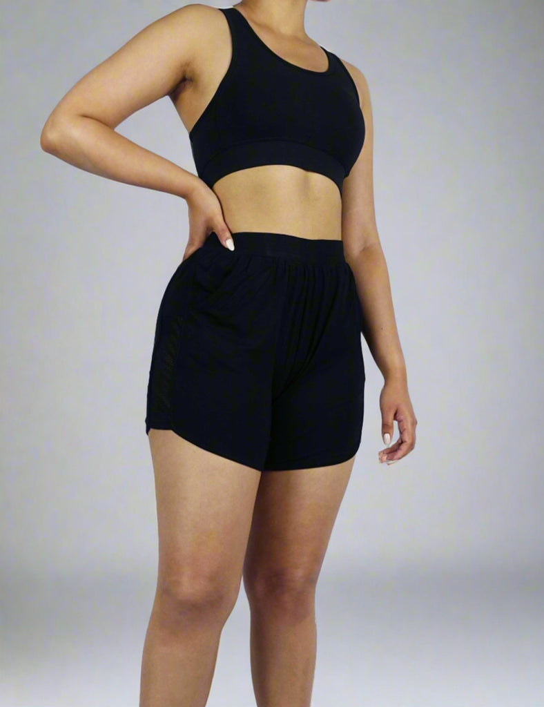 Black women's shorts with mesh fabrication on sides