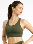 Woman wearing a green sports bra khaki-bamboo-sports-bra-womens-activewear_activebygs against a white background