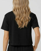 Back view model wearing an oversized boxy crop t-shirt in soft bamboo fabric