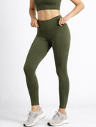Person wearing green leggings and a cropped top womens bamboo breathable high-waist-phone pocket compression-leggings-khaki-womens_activebygs on a white background