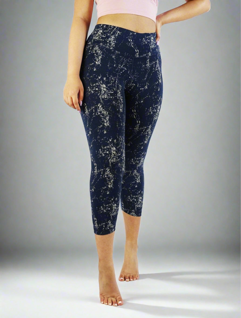 Woman wearing blue crop leggings with prints