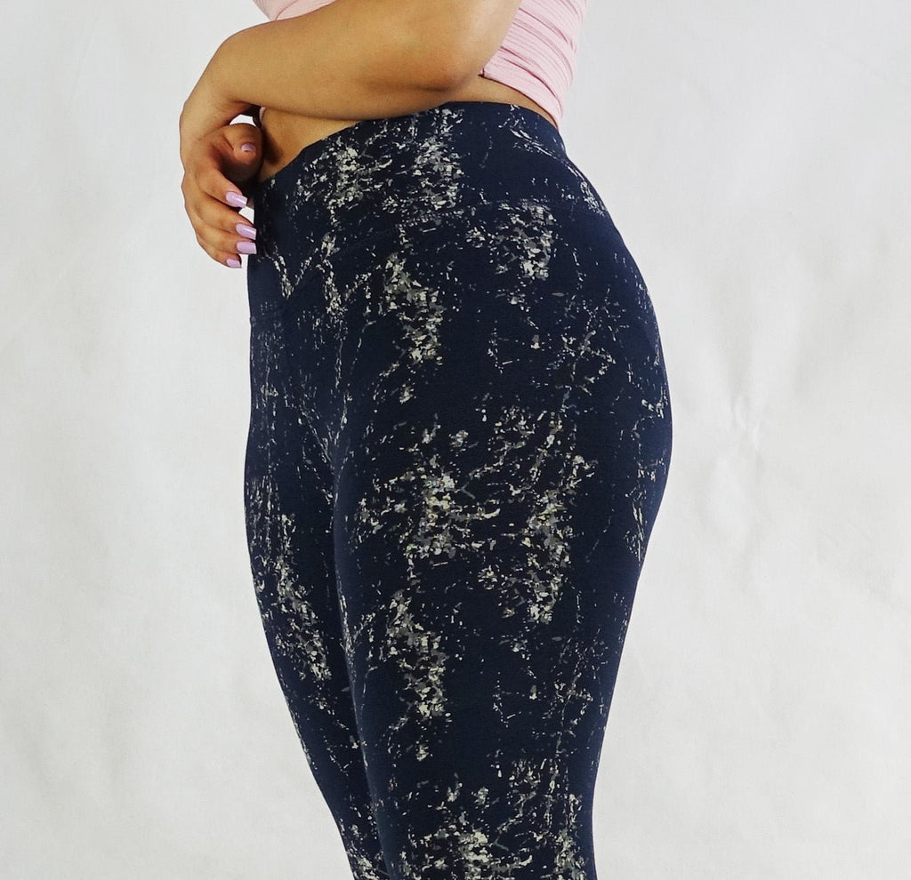 Close up side view of women's blue full length leggings