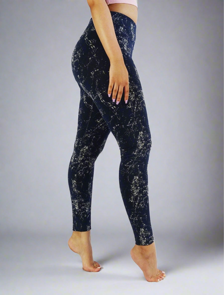 Side view of blue full length leggings with white prints