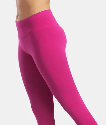 Side view of woman wearing pink full length leggings