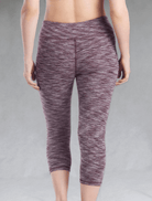 The bamboo crop legging in the Plum Heather print is shown in a back view.