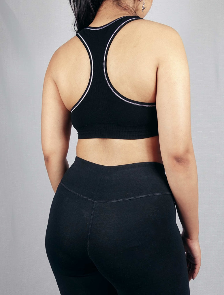 Back view of black padded soft ribbed sports bra 