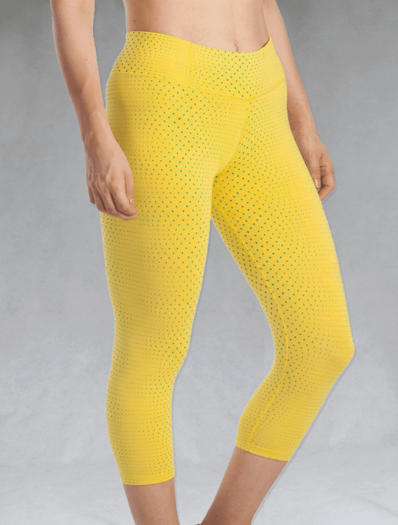 Model wearing sunshine yellow crop leggings
